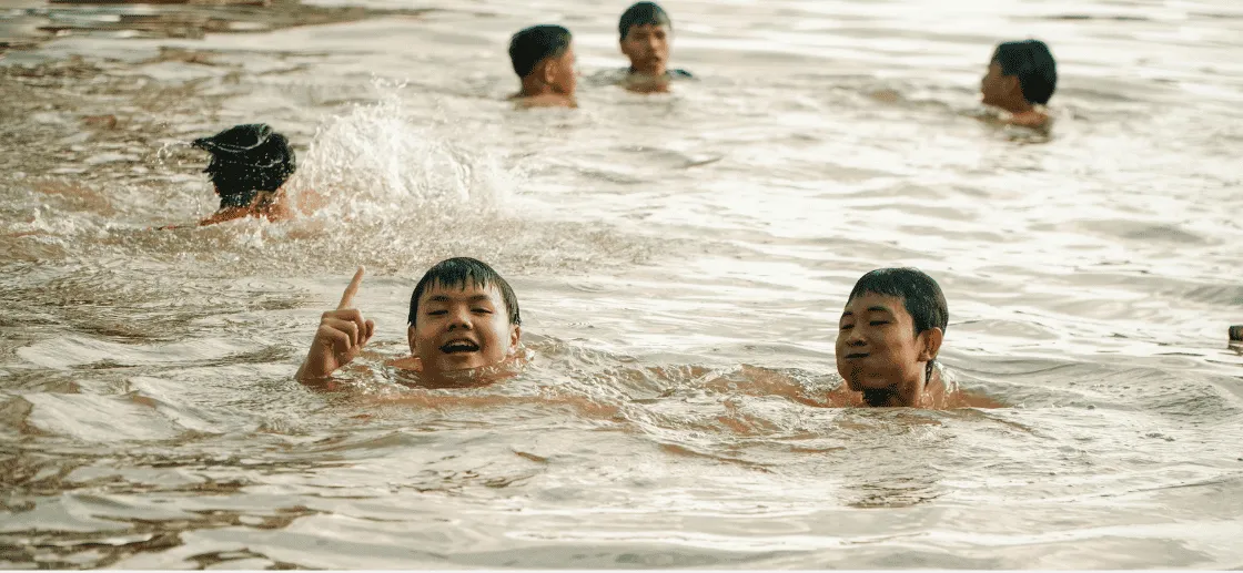 Friendly Dolphin Swim School instructors and students at the pool